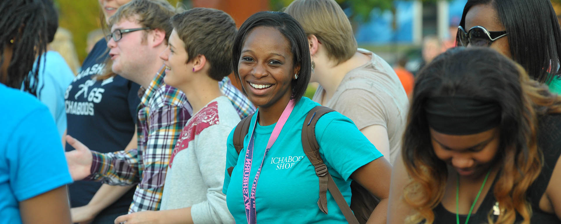 Student at an event smiling 